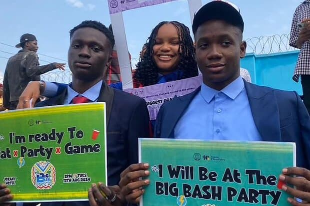 Students holding Big Bash placards