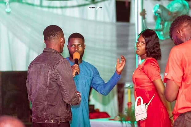 A host on stage at the Urban Prom